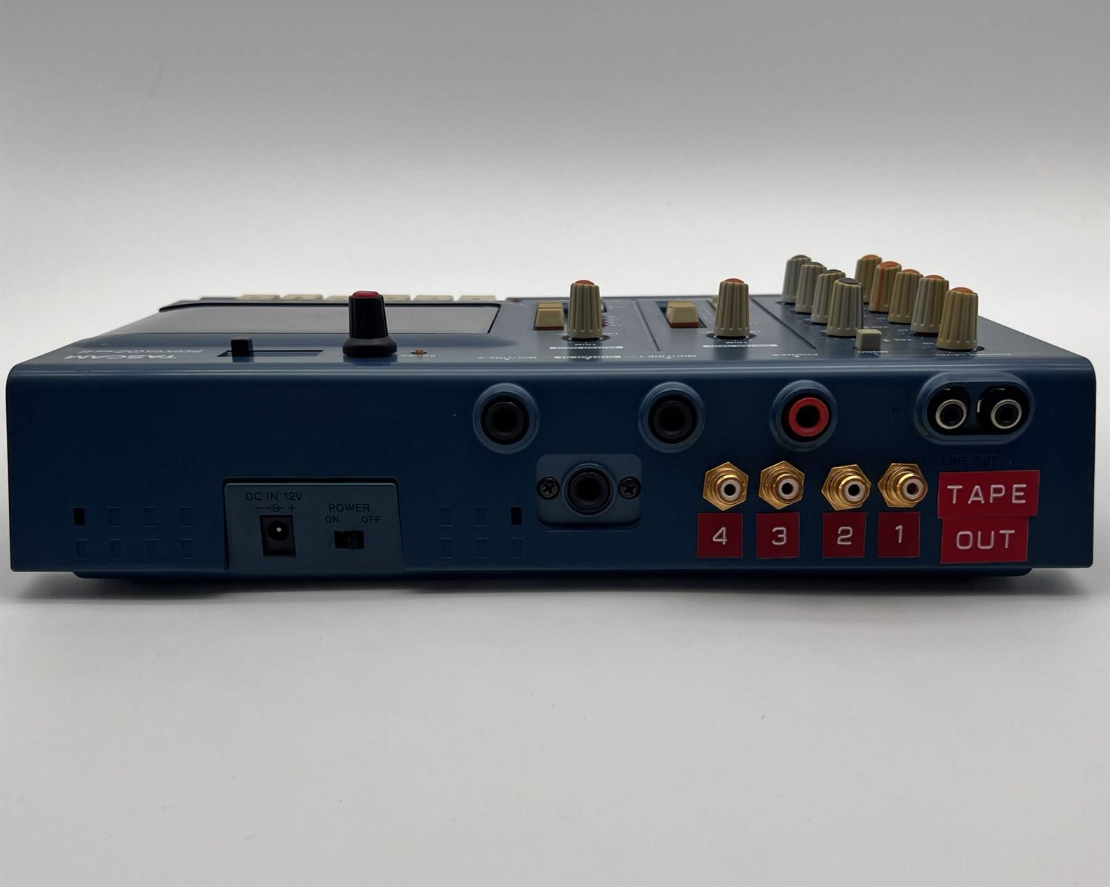 Rear of a Tascam Porta 02 with four RCA tape outs
