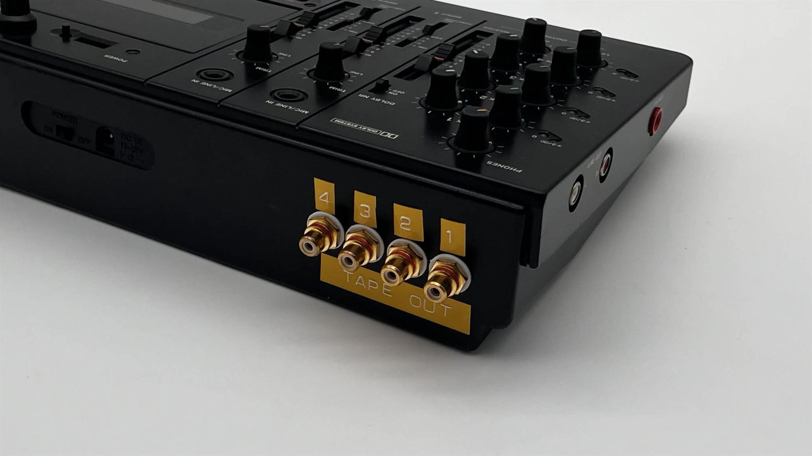 Black multitrack recorder with four gold RCA tape outs